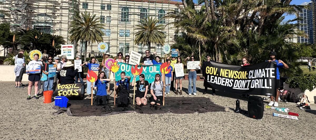 La Jolla teen Emma Weibel (front, second from left) organized a June 29 protest in San Diego against fossil fuel dependence.