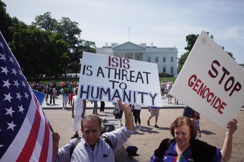 Demonstrators rally against the Islamic State militant group, also known by the acronym ISIS, outside the White House on Aug. 16.