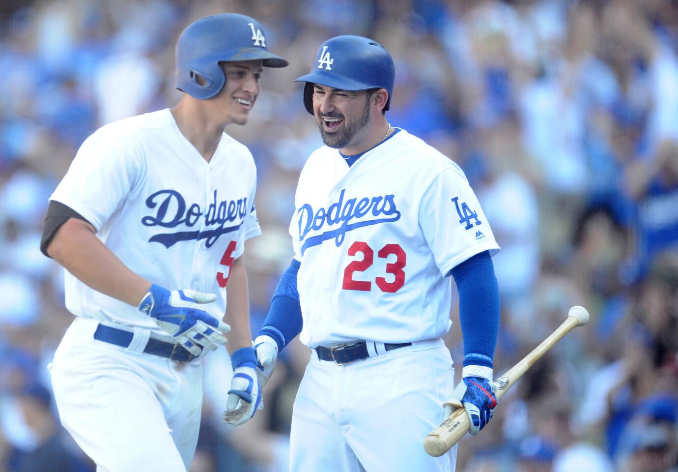 September 25, 2016; Los Angeles, CA, USA; Los Angeles Dodgers shortstop Corey Seager (5) is greeted by first baseman Adrian Gonzalez (23) after he hits a solo home run in the ninth inning against the Colorado Rockies at Dodger Stadium. Mandatory Credit: Gary A. Vasquez-USA TODAY Sports ** Usable by SD ONLY **