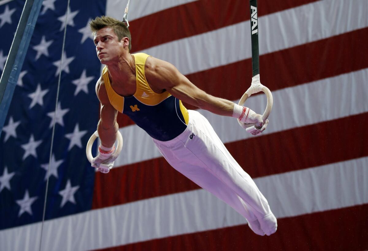 Sam Mikulak, shown at U.S. men's national gymnastics championships in August, leads in the standings after the first of four subdivisions at the World Gymnastics Championships in Antwerp, Belgium.