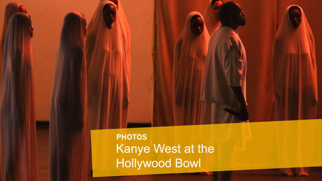 Kayne West, right, performs songs from his 2008 studio album "808s & Heartbreak" at the Hollywood Bowl on Sept. 25, 2015.