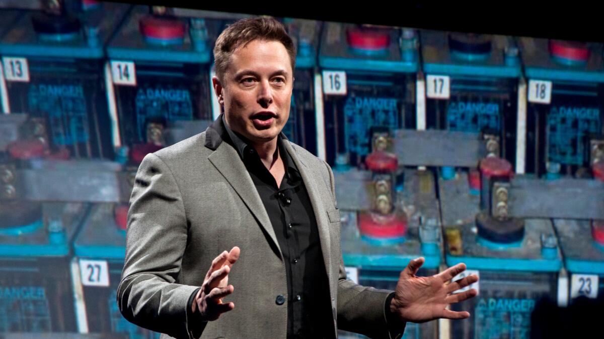 Elon Musk, shown in 2015, is chairman of SolarCity and Tesla Motors' chairman and CEO. He owns large stakes in both companies.