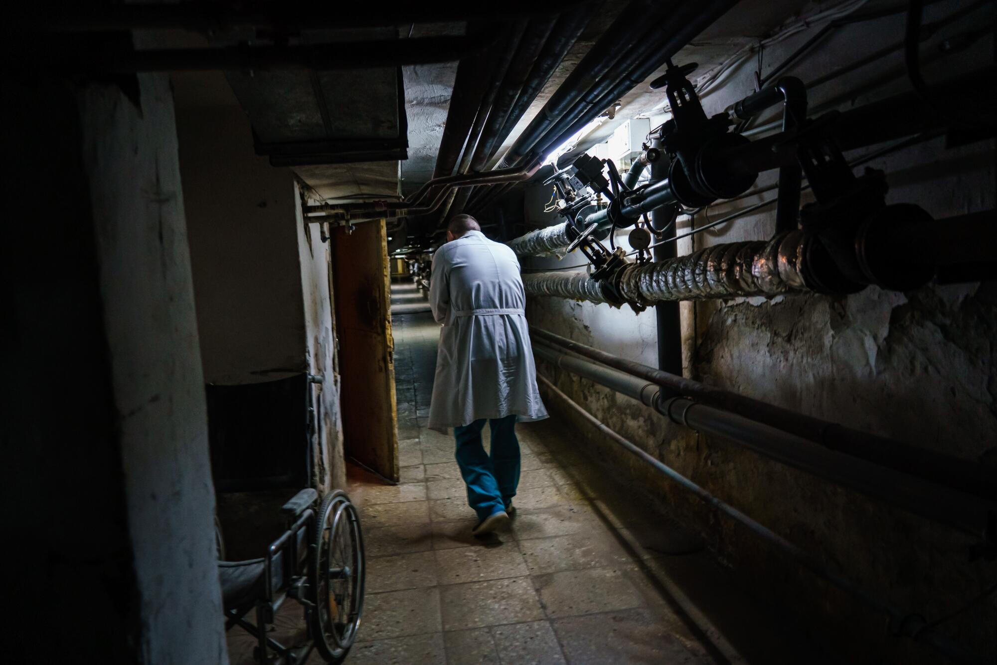 Dr. Volodymyr Andriiets heads toward a bomb shelter under a hospital in Brovary, Ukraine.