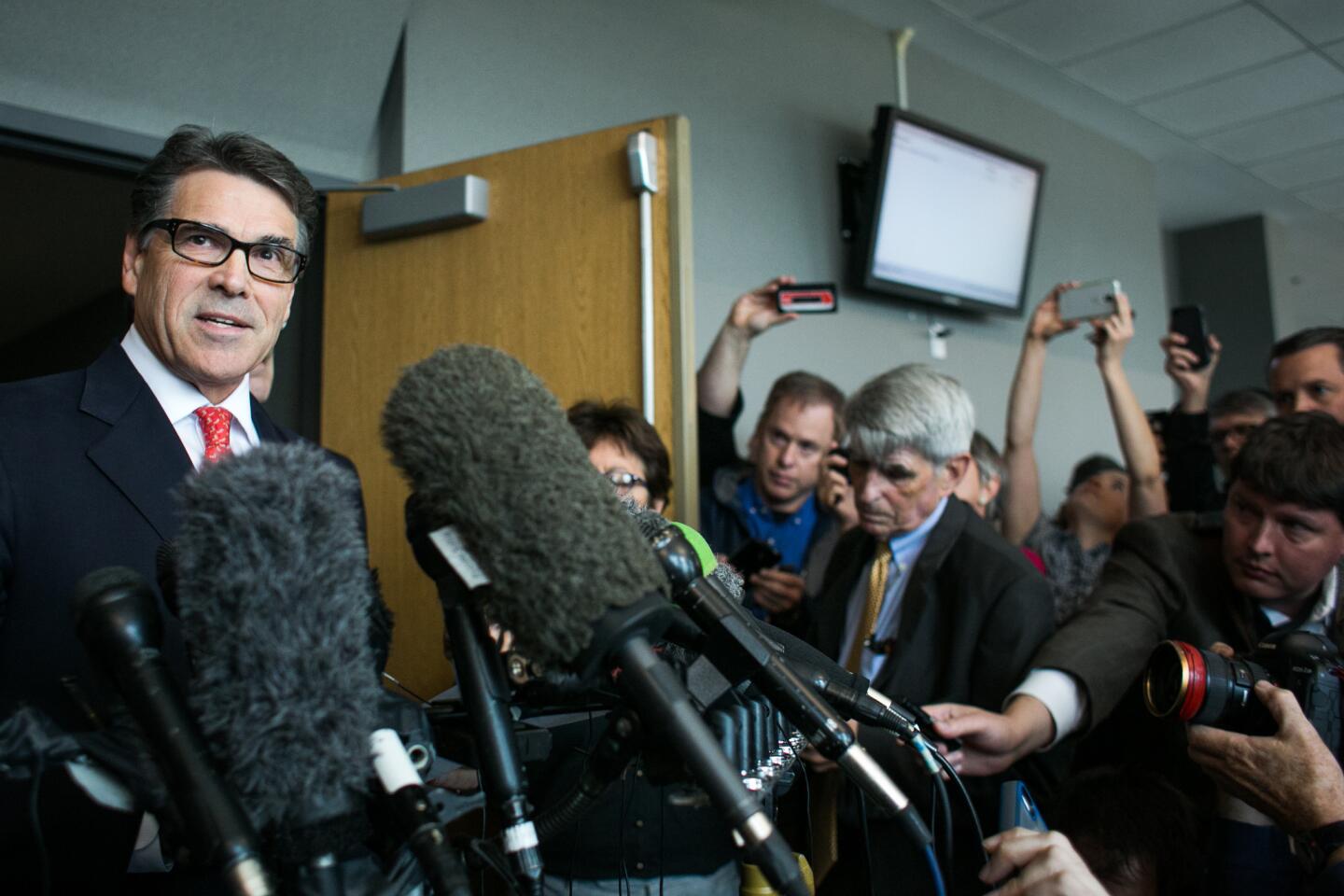 Texas Governor Rick Perry answers questions from members of the media at the Blackwell-Thurman Criminal Justice Center on November 6, 2014 in Austin, Texas.