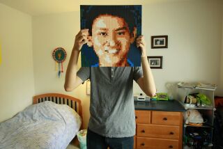 Eric Chen with a Lego portrait of himself.