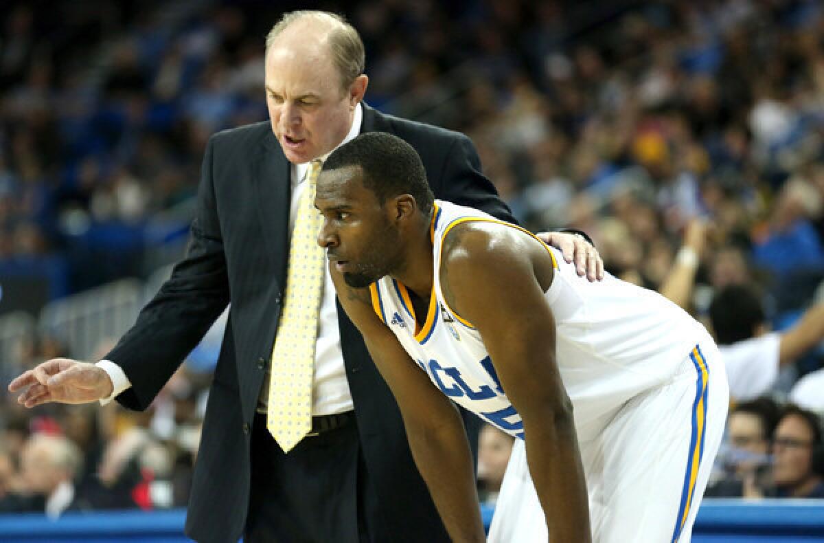 UCLA Coach Ben Howland talks with freshman Shabazz Muhammad during a game against Washington State at Pauley Pavilion.