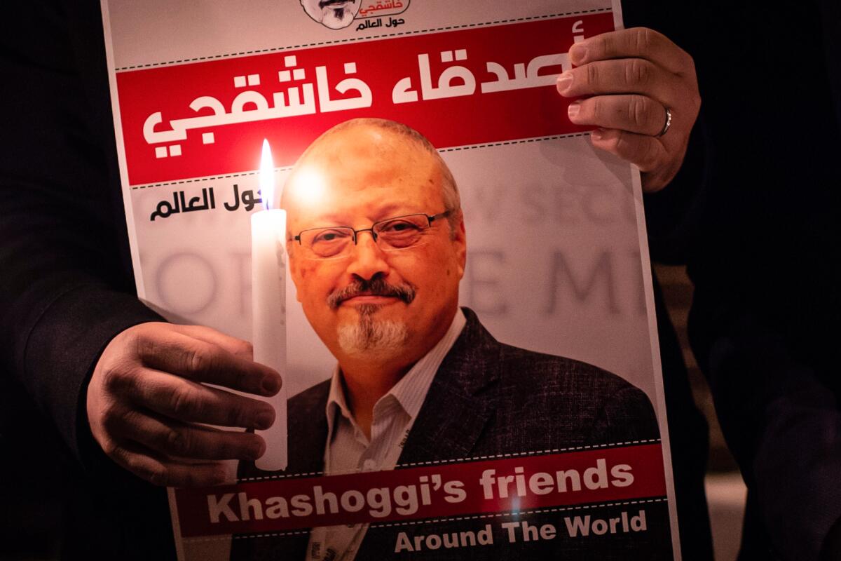 A poster depicting Jamal Khashoggi reads "Khashoggi's friends Around the World."
