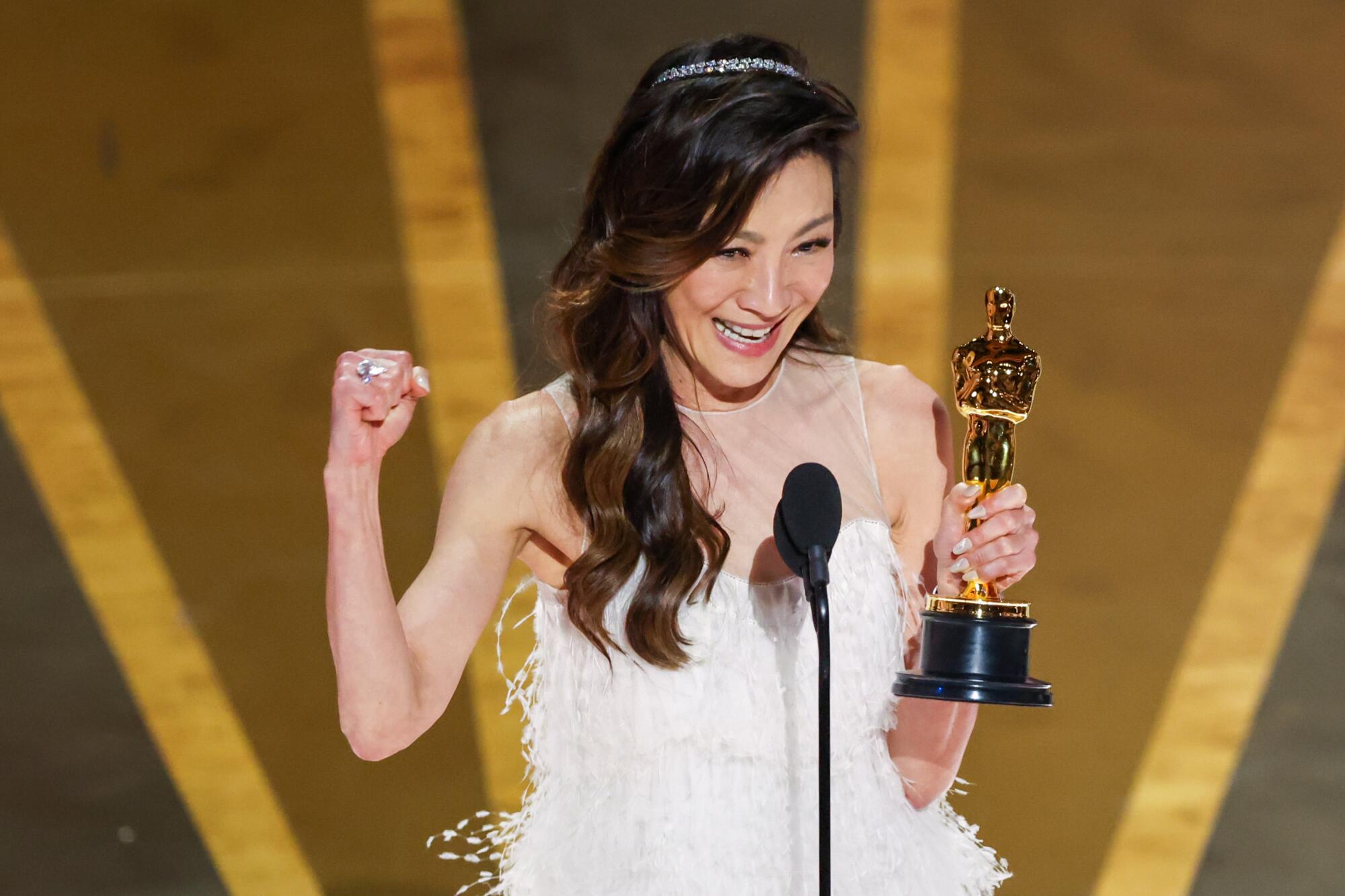 A woman accepts an award