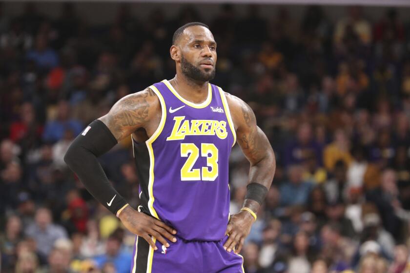 Los Angeles Lakers LeBron James (23) pauses on the court in the second half of a NBA basketball game against the Memphis Grizzlies Saturday, Nov. 23, 2019, in Memphis, Tenn. (AP Photo/Karen Pulfer Focht)