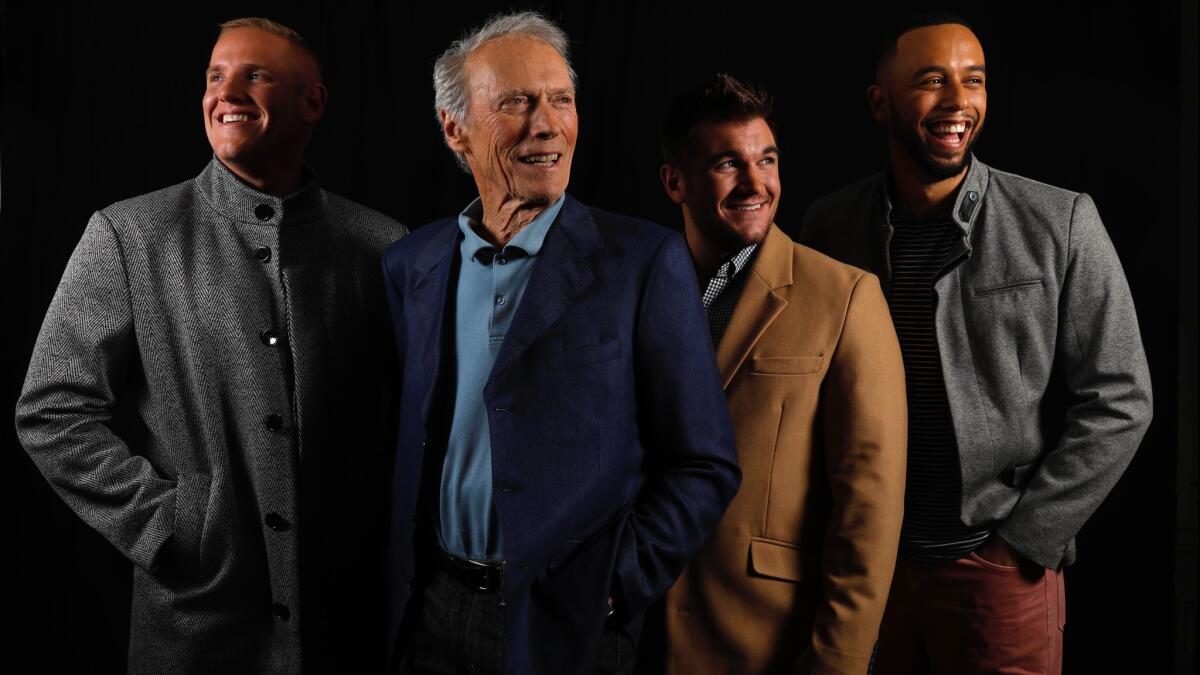 Clint Eastwood, second from left, with Spencer Stone, from left, Alek Skarlatos and Anthony Sadler, who play themselves in the movie "The 15:17 to Paris."
