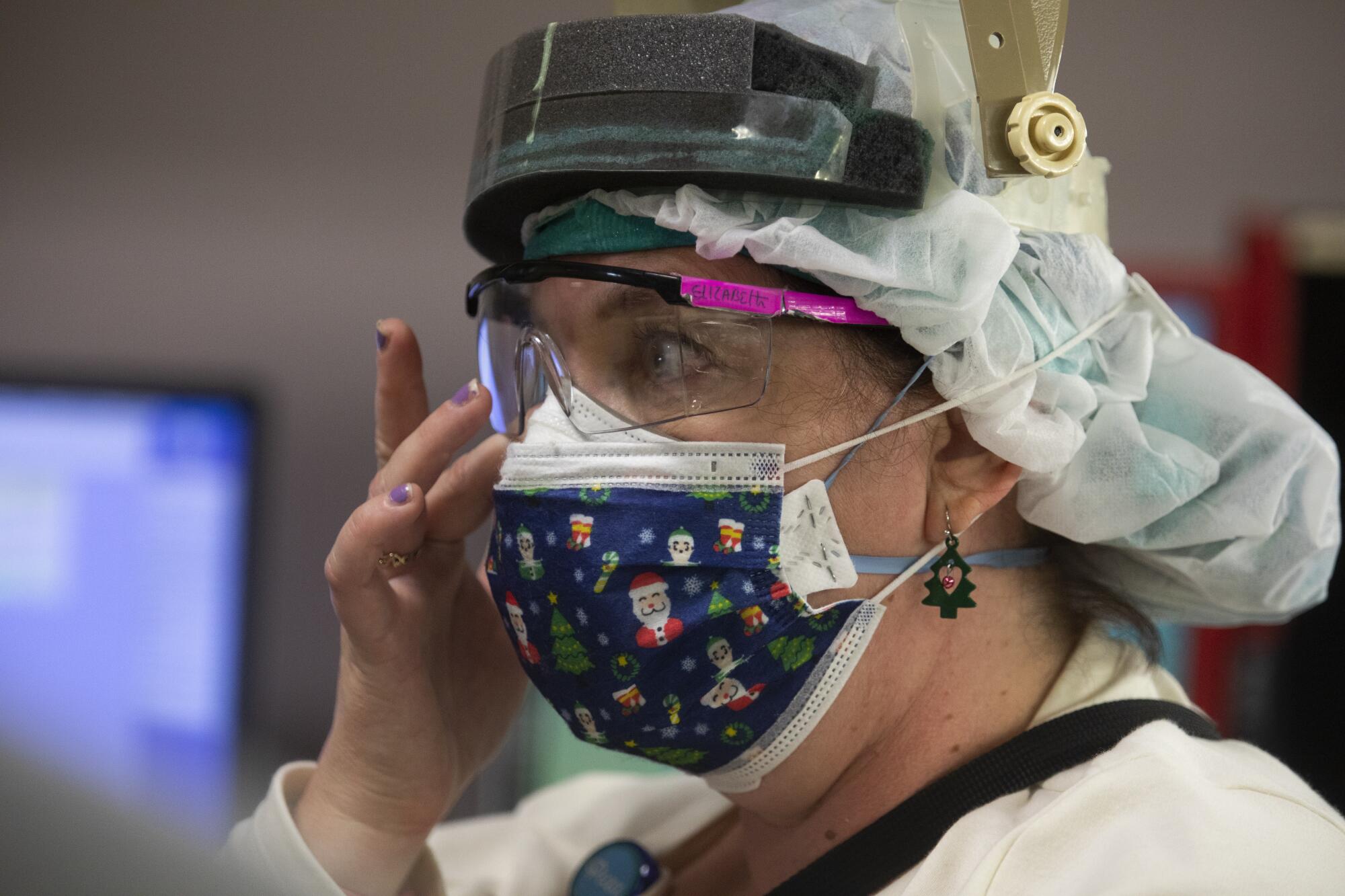 Nurse Elizabeth Waite begins to cry inside the ICU 