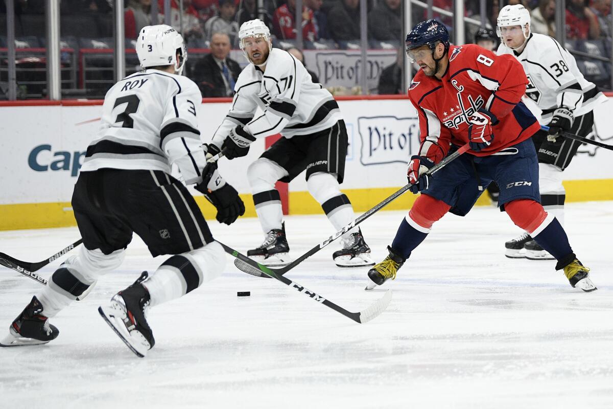 Washington Capitals left wing Alex Ovechkin (8) skates with the puck in front of Kings defenseman Matt Roy (3) during the second period on Tuesday in Washington.
