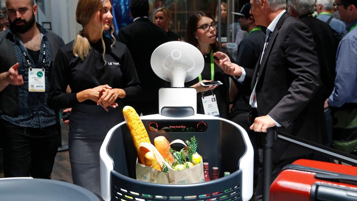 The Cloi shopping cart robot appears at LG's CES booth.