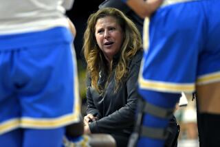 UCLA coach Cori Close talks to players during the 2022 Pac-12 conference tournament