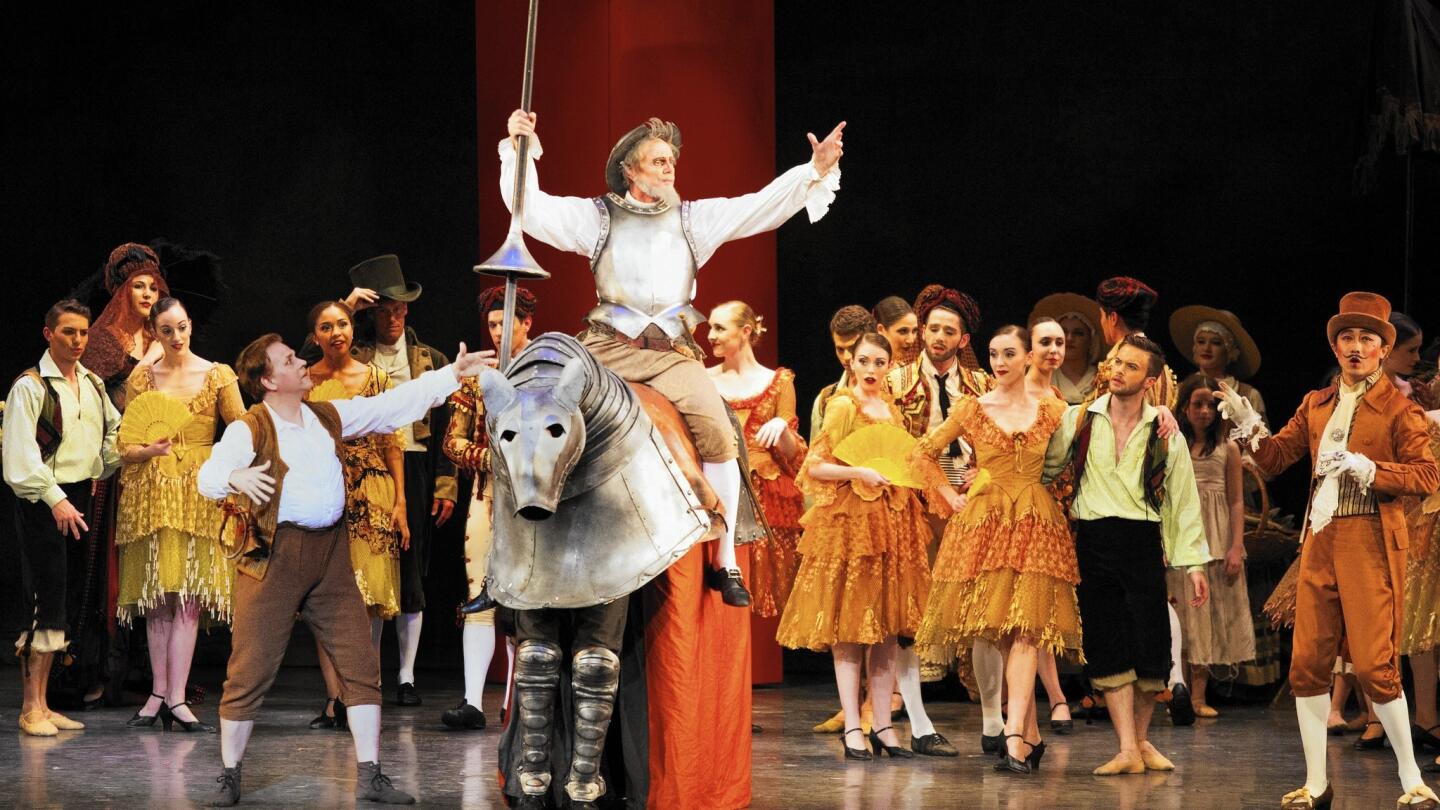 Adam Luders, on horse, is Don Quixote and David Renaud, left, performs as Sancho Panza in the Los Angeles Ballet's “Don Quixote,” which premiered at the Redondo Beach Performing Arts Center.