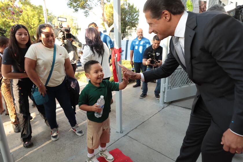 Los Angeles, CA - August 12, 2024: Los Angeles Unified Superintendent Alberto M. Carvalho greets students and families at Main Street Elementary School on the first day of the 2024-25 school year. (Al Seib / For The Times)