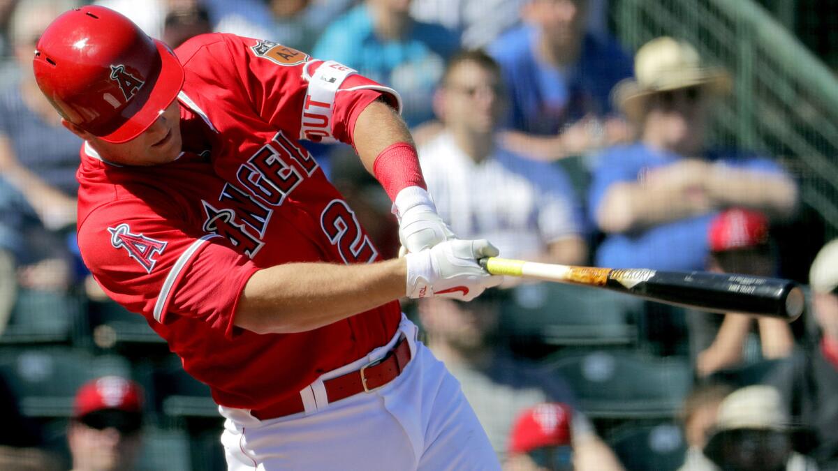 Angels center fielder Mike Trout follows through on a double against the Rangers during the third inning on March 1.