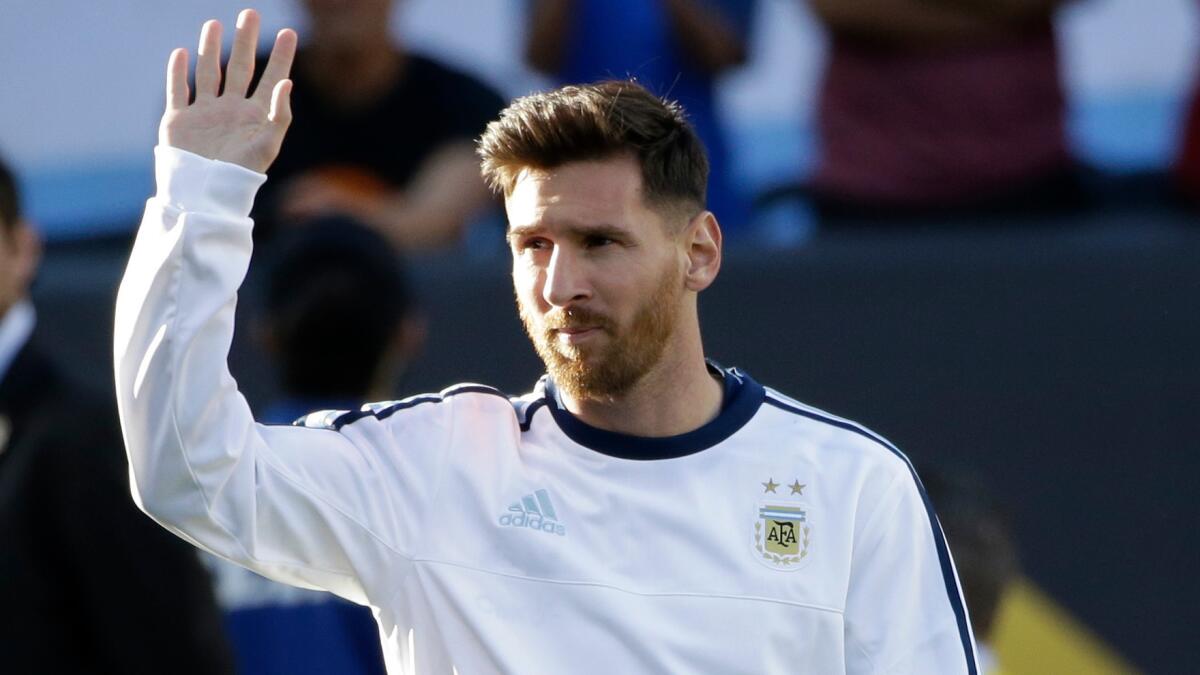 Lionel Messi waves before Argentina's match against Chile.