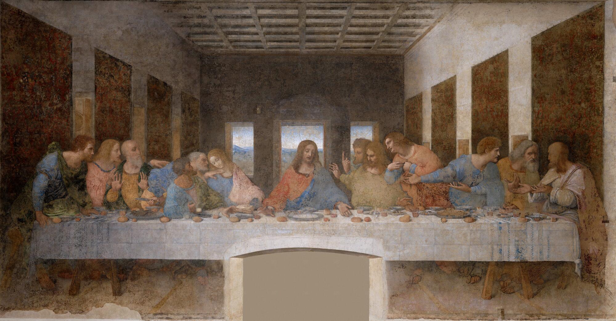 A painting of the disciples of Christ seated at a long table with a white table cloth.