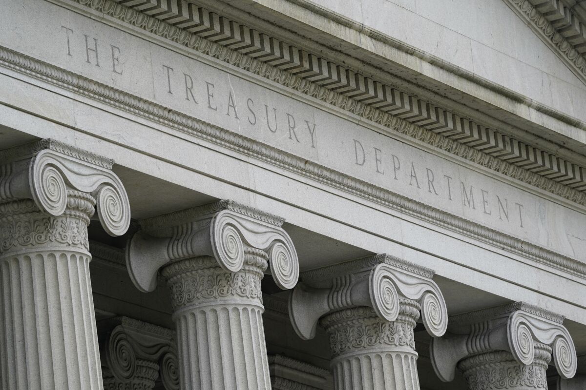 The words The Treasury Department adorn the facade of a building 