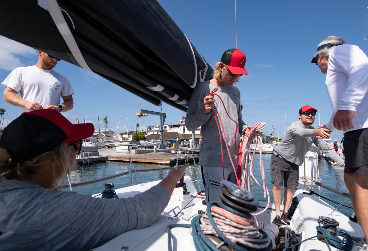 The crew of the Blitzen prepares the boat Friday ahead of the Long Point Yacht Race.