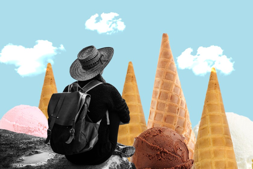 Hiker looking at mountains made of ice cream cones