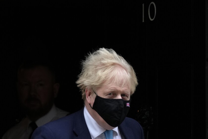 Britain's Prime Minister Boris Johnson leaves 10 Downing Street to attend the weekly Prime Ministers' Questions session in parliament in London, Wednesday, Jan. 26, 2022. Johnson is bracing for the conclusions of an investigation into allegations of lockdown-breaching parties, a document that could help him end weeks of scandal and discontent, or bring his time in office to an abrupt close. (AP Photo/Kirsty Wigglesworth)