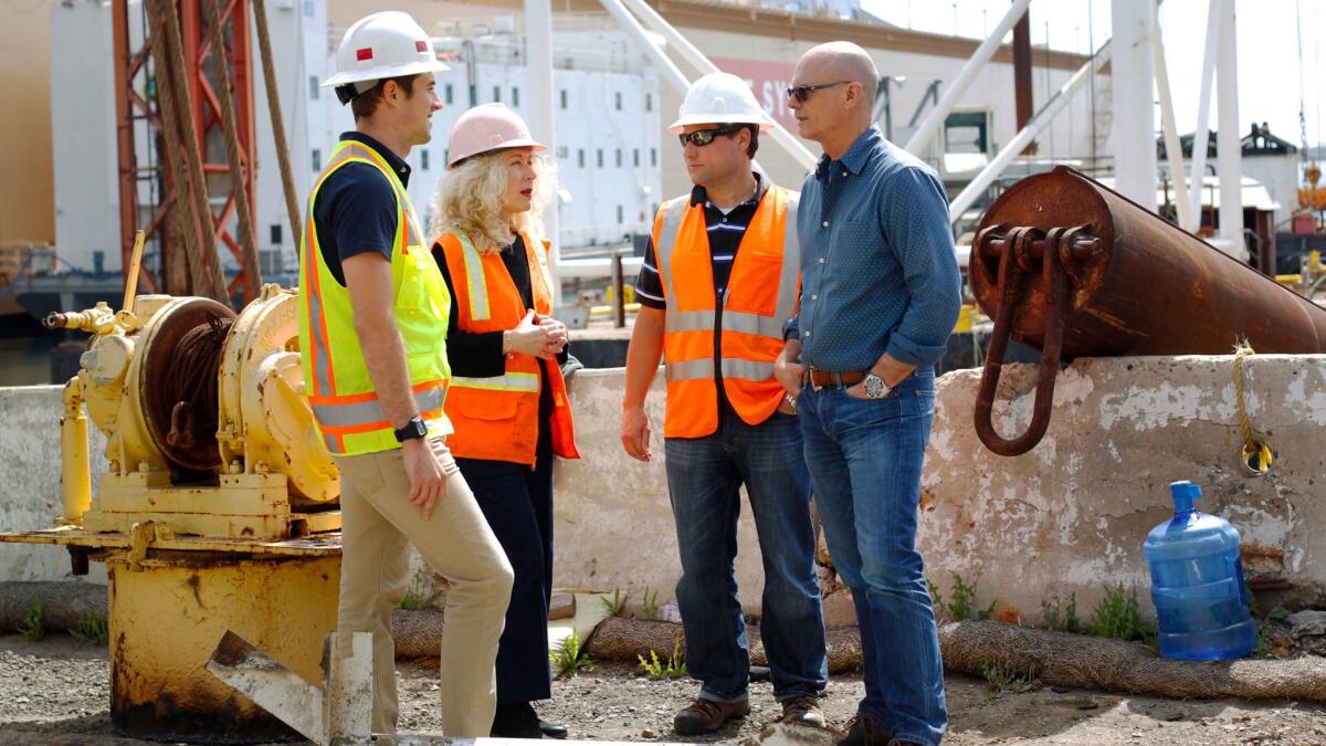 Ralph Hicks, right, a vice president at R.E. Staite Engineering in San Diego, says his company is very enthusiastic about its proposal for how to build a U.S.-Mexico border wall.