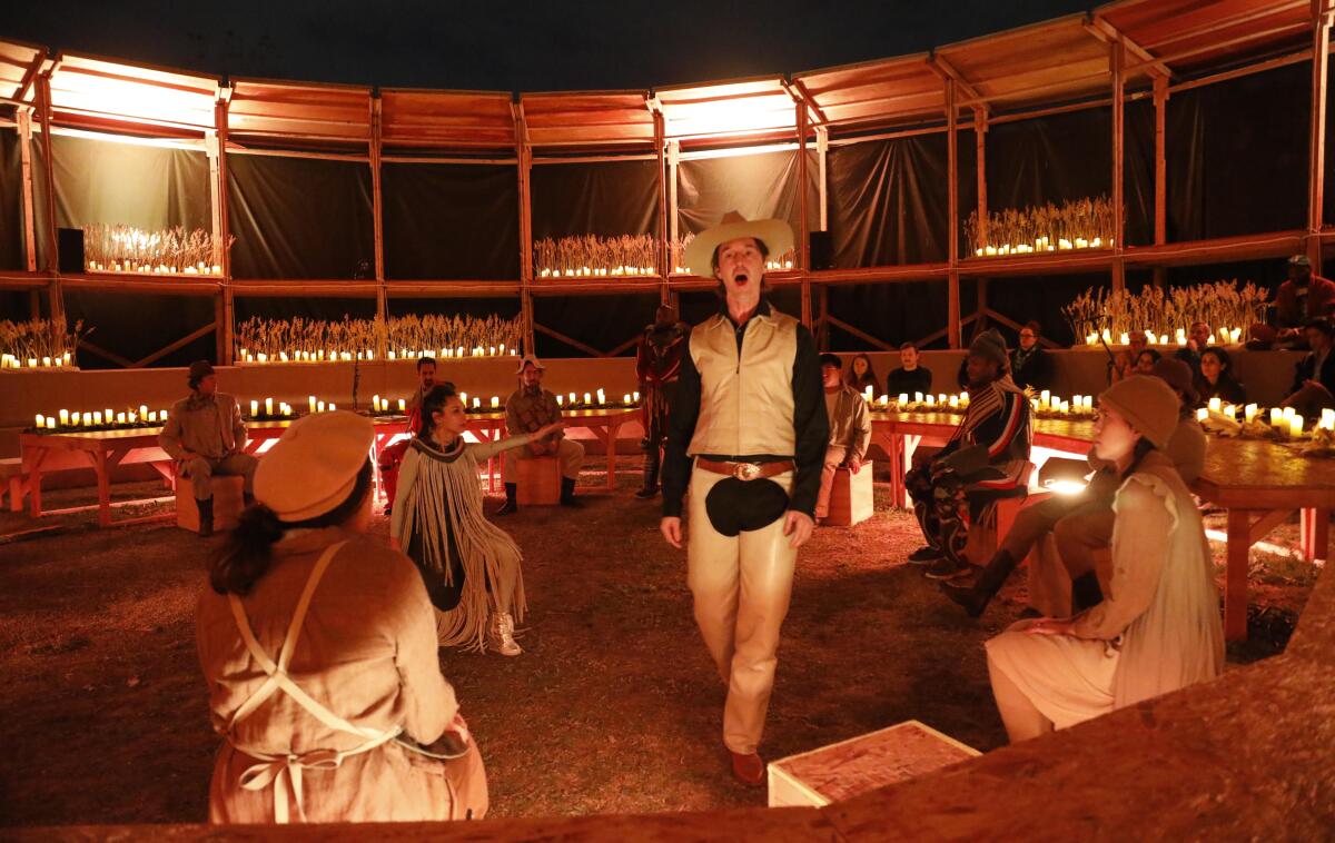 Scott Belluz, center, and other performers with the Industry perform in "Sweet Land," at Los Angeles State Historic Park on Feb. 21, 2020.