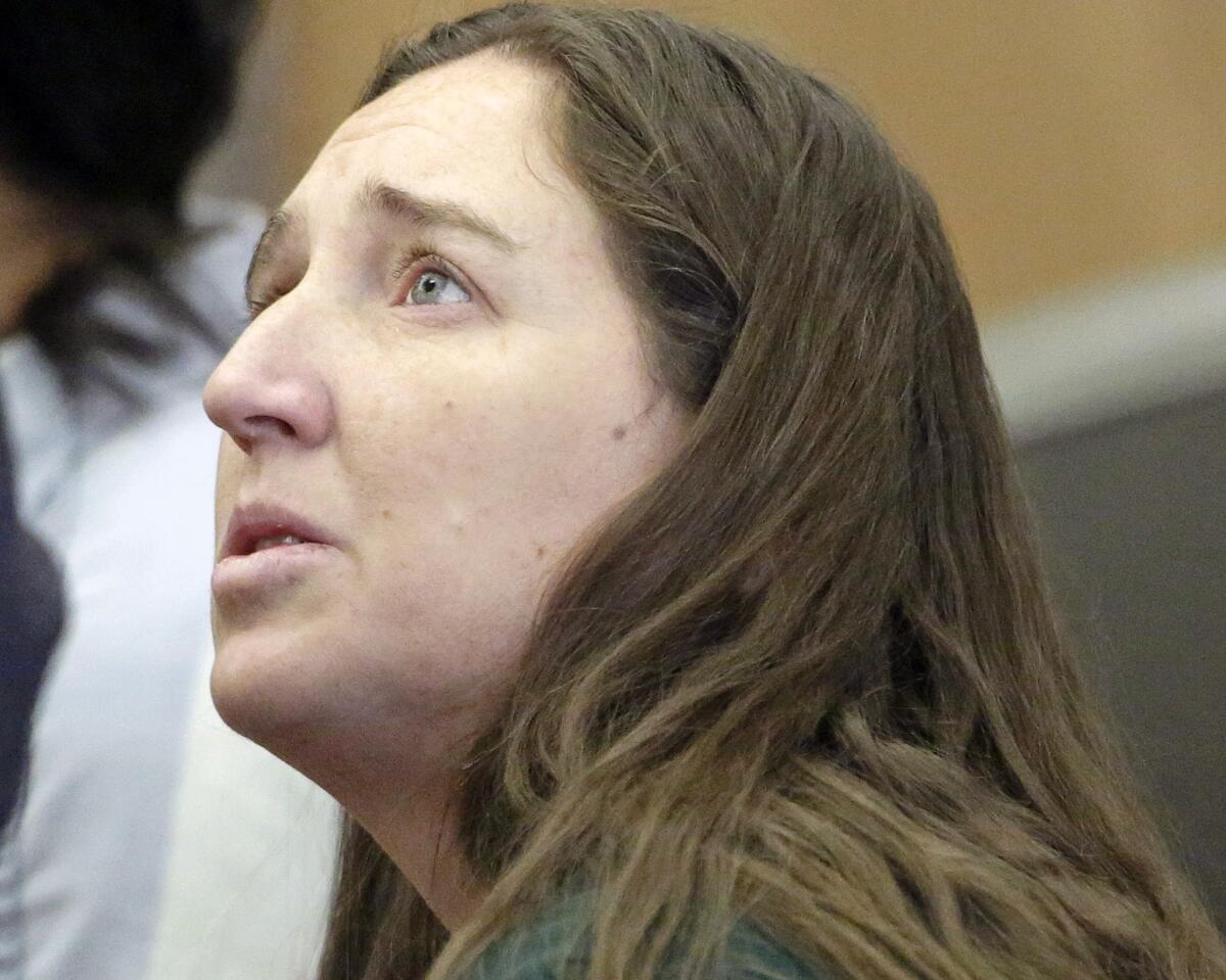 Megan Huntsman appears in court April 21. She is accused of killing six of her babies and storing their bodies, plus that of a stillborn, in her garage.