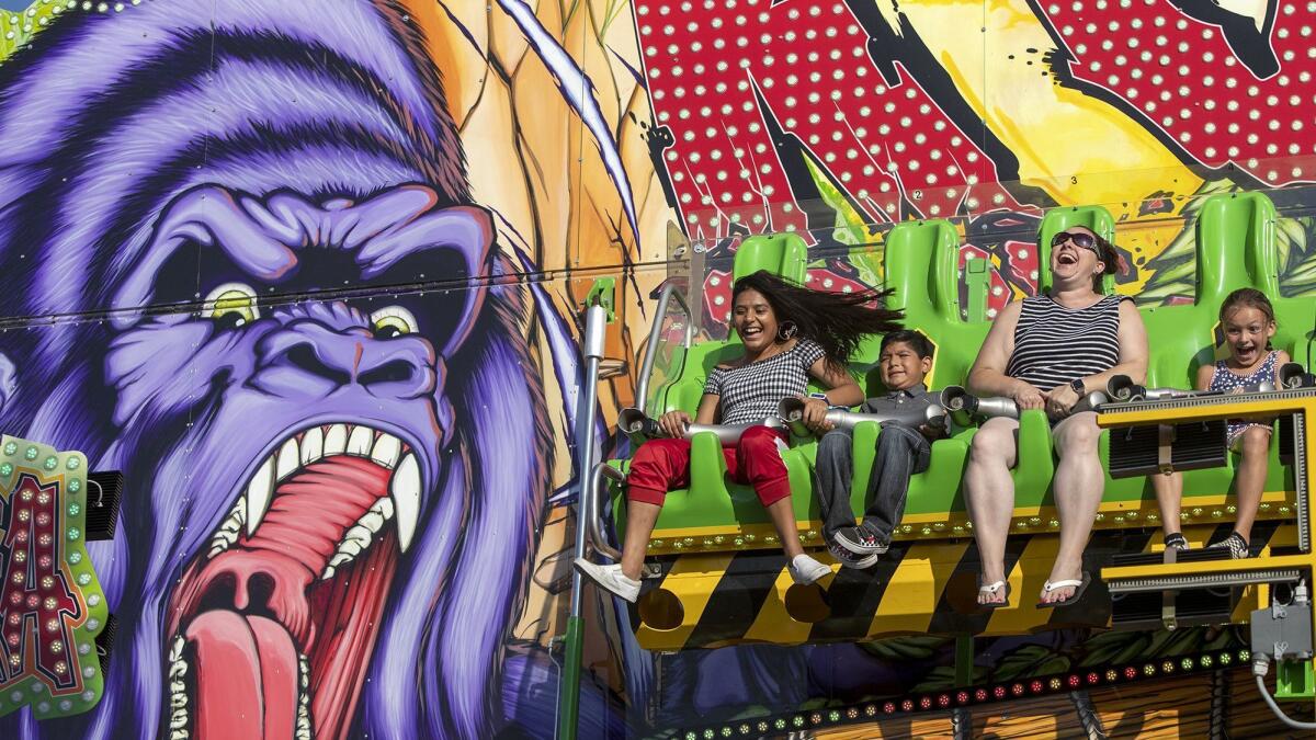 Fairgoers enjoy the ride Konga at the Orange County Fair.