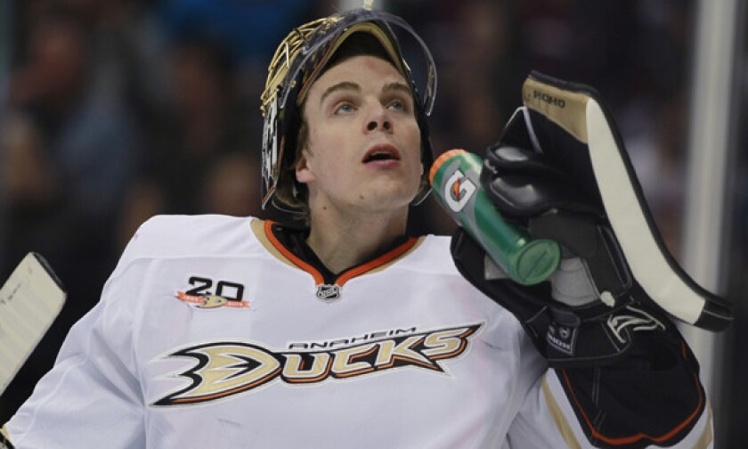Ducks goalie Jonas Hiller takes a drink after giving up a goal to the Colorado Avalanche in a March 14 game. There's a good chance Hiller will be on the bench when the Ducks open the playoffs against the Dallas Stars on Wednesday.