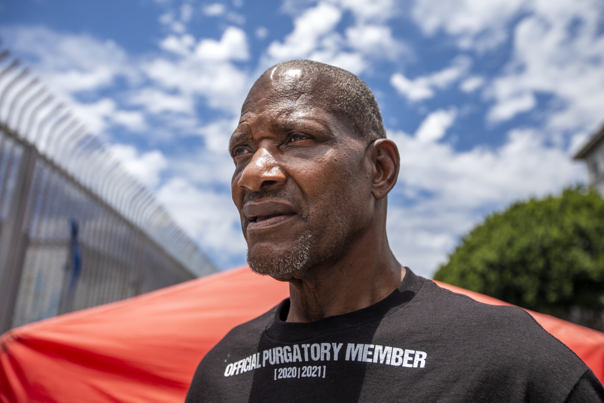 A man standing near a tent