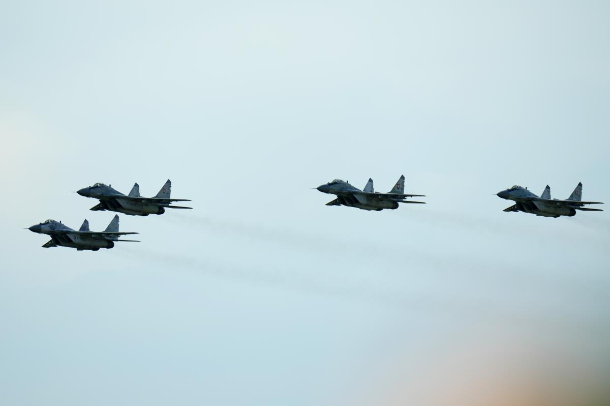 Four Slovak air force MiG-29s fighter jets in the sky
