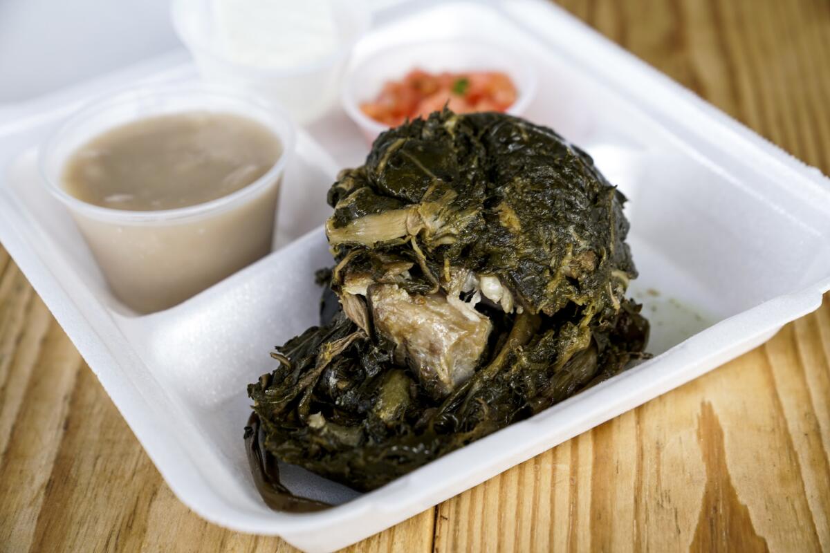 The Laulau combination plate, with Poi, Haupuia, and lomi salmon at the Waiahole Poi Factory.