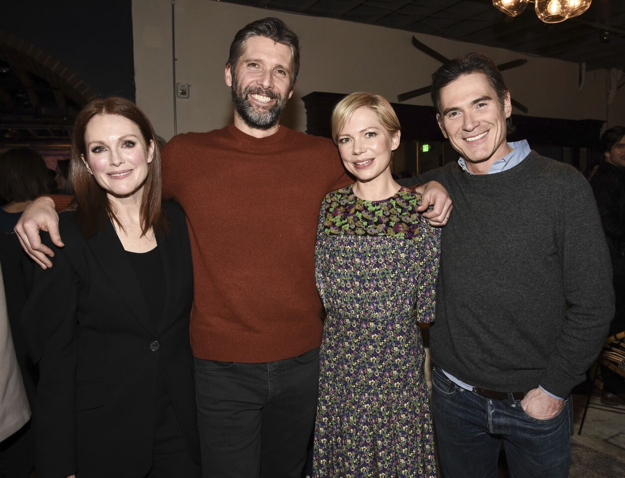 Actress Julianne Moore, left, director Bart Freundlich, actress Michelle Williams and actor Billy Crudup at the "After the Wedding" after-party on Friday at the Sundance Film Festival in Park City, Utah.