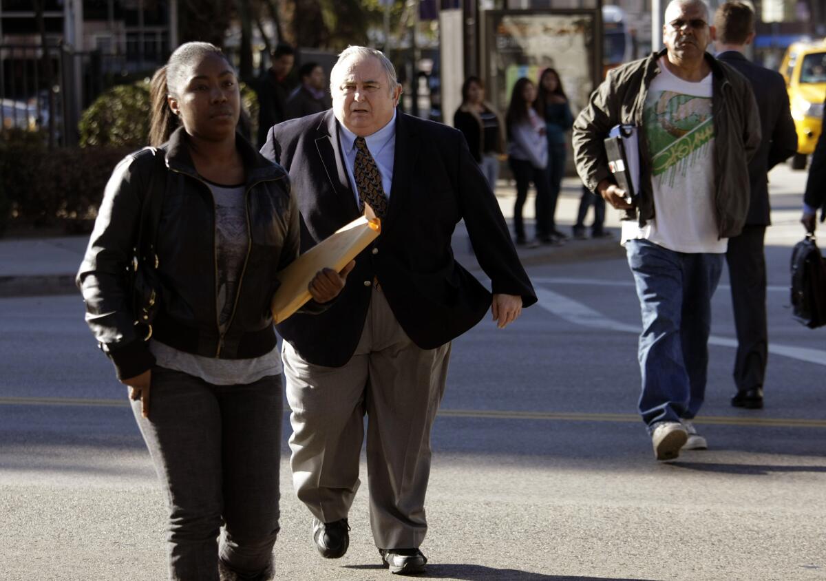 Robert Rizzo walks toward the federal federal courthouse earlier this week.