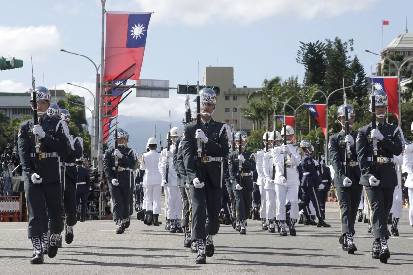 The military honor guard attend during National Day celebrations in front of the Presidential Building in Taipei, Taiwan, Sunday, Oct. 10, 2021. (AP Photo/Chiang Ying-ying)