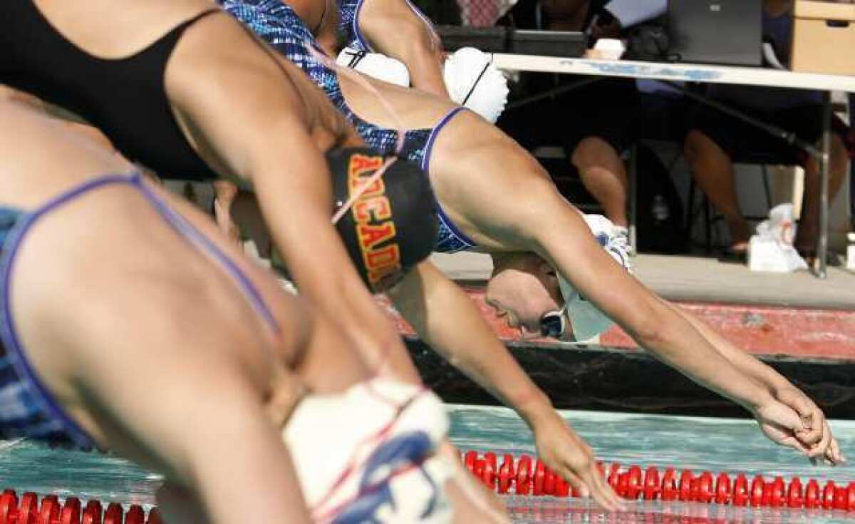 Crescenta Valley High's Iva Icheva, far right, won two individual events in a Pacific League dual meet with Arcadia.