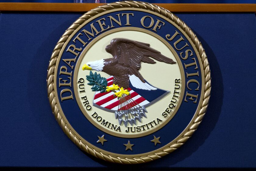 FILE - The Department of Justice seal is seen in Washington, Nov. 28, 2018. The Biden administrating is putting forth seven new Justice Department nominations covering three U.S. attorney's offices in Texas and other senior posts. (AP Photo/Jose Luis Magana, File)