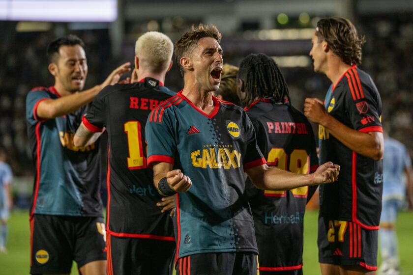 CARSON, CA - AUGUST 24: Gastón Brugman #5 of Los Angeles Galaxy celebrates a goal.