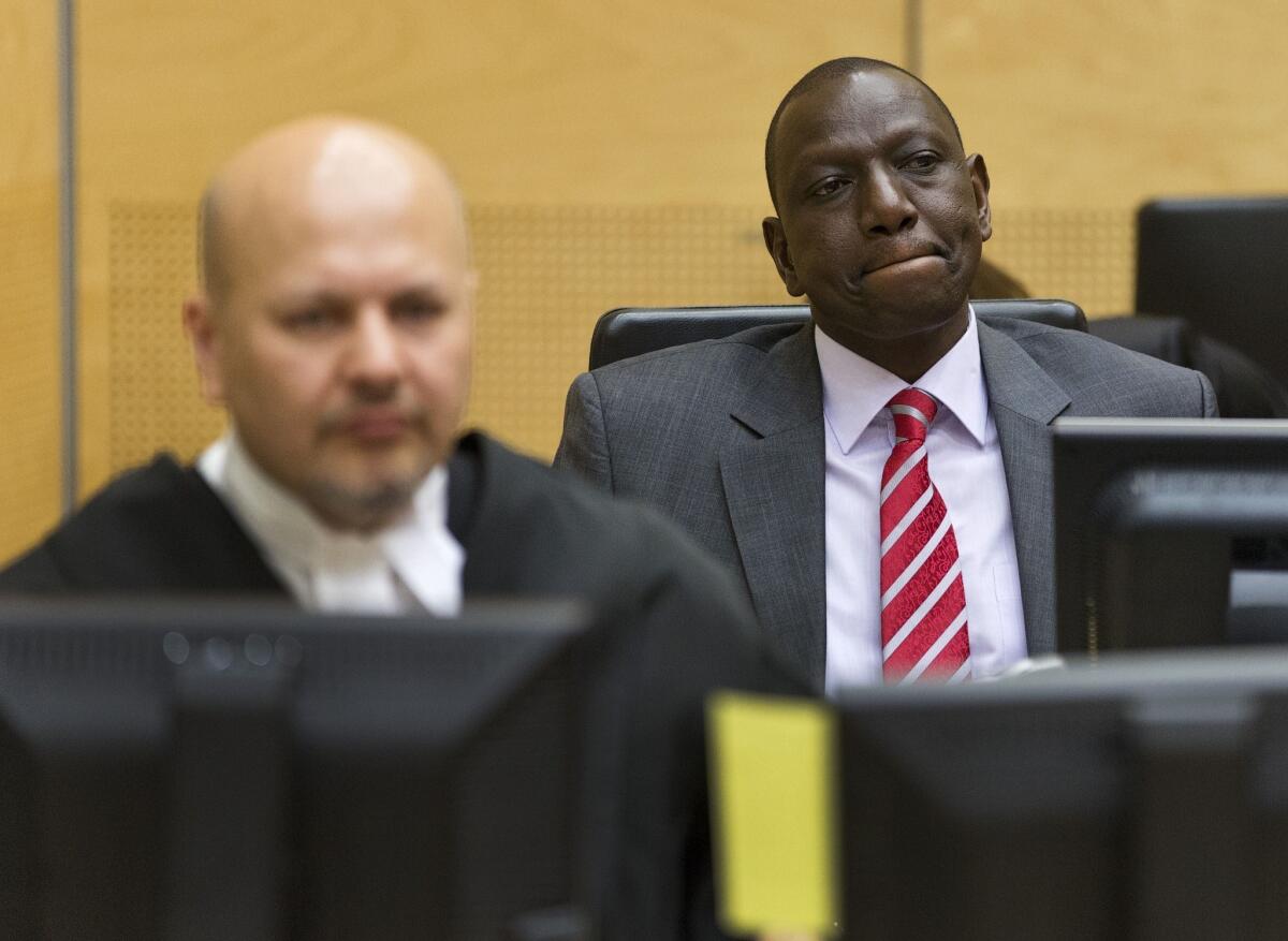 Kenyan Deputy President William Ruto, right, appears before the International Criminal Court in the Hague.