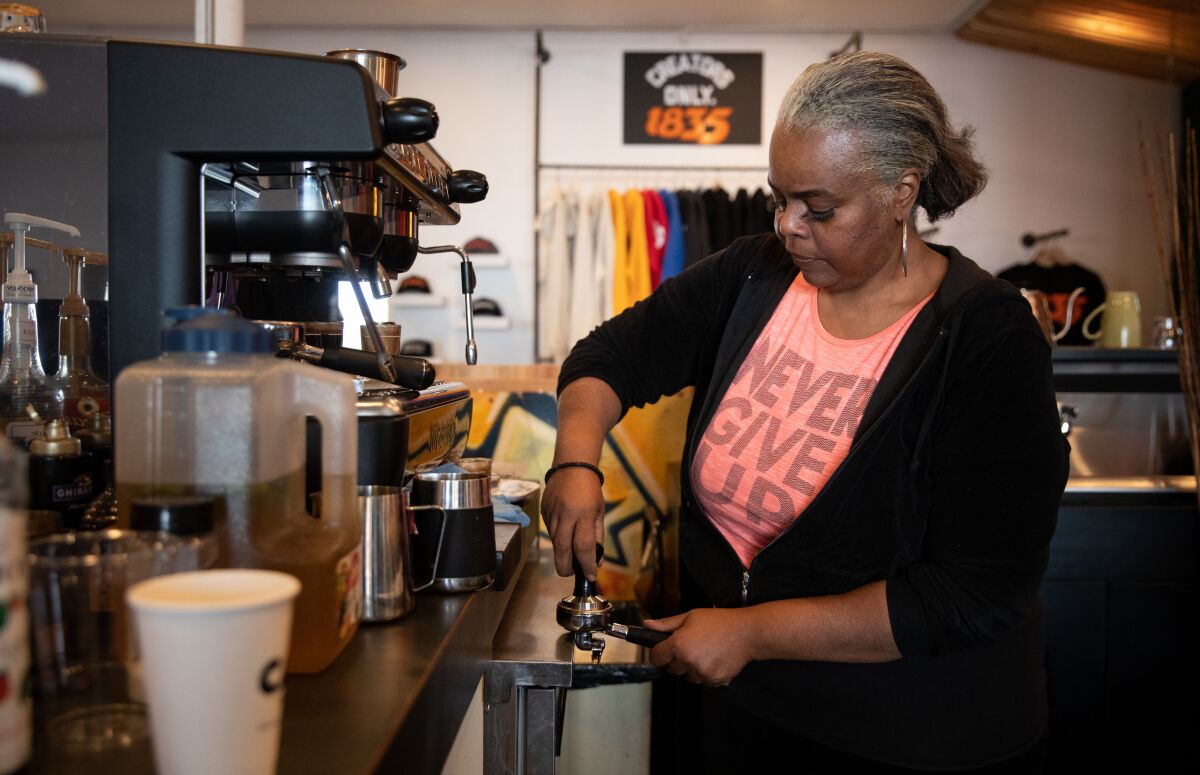 Cynthia Ajani makes a coffee at Cafe X: By Any Beans Necessary.
