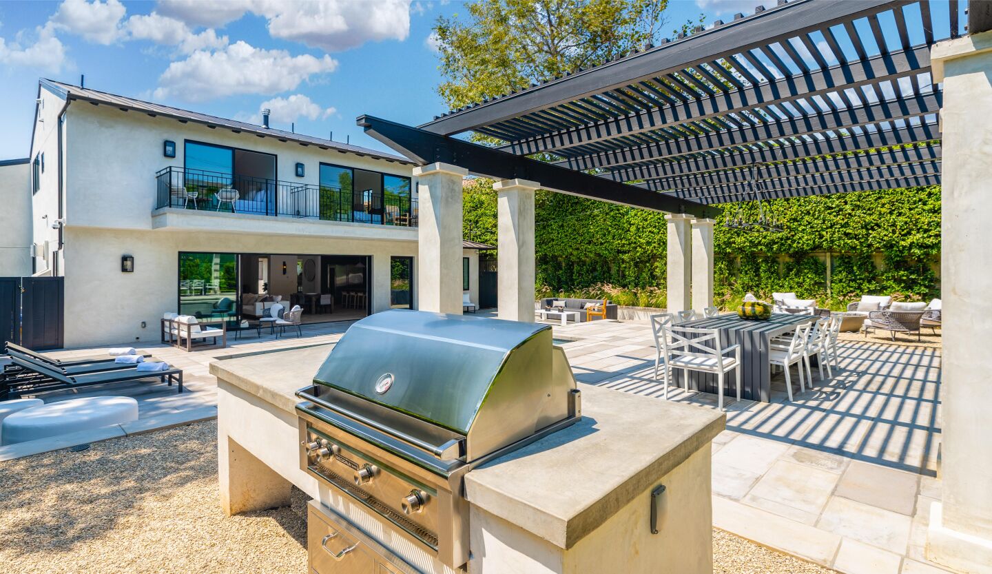 Remodeled in 2020, the four-bedroom farmhouse features a design palette of French oak floors and Italian tile across 3,652 square feet.