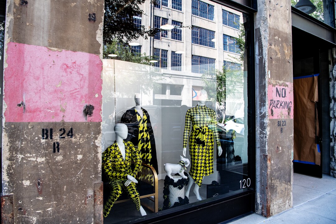 Three mannequins in a storefront window in downtown Los Angeles.