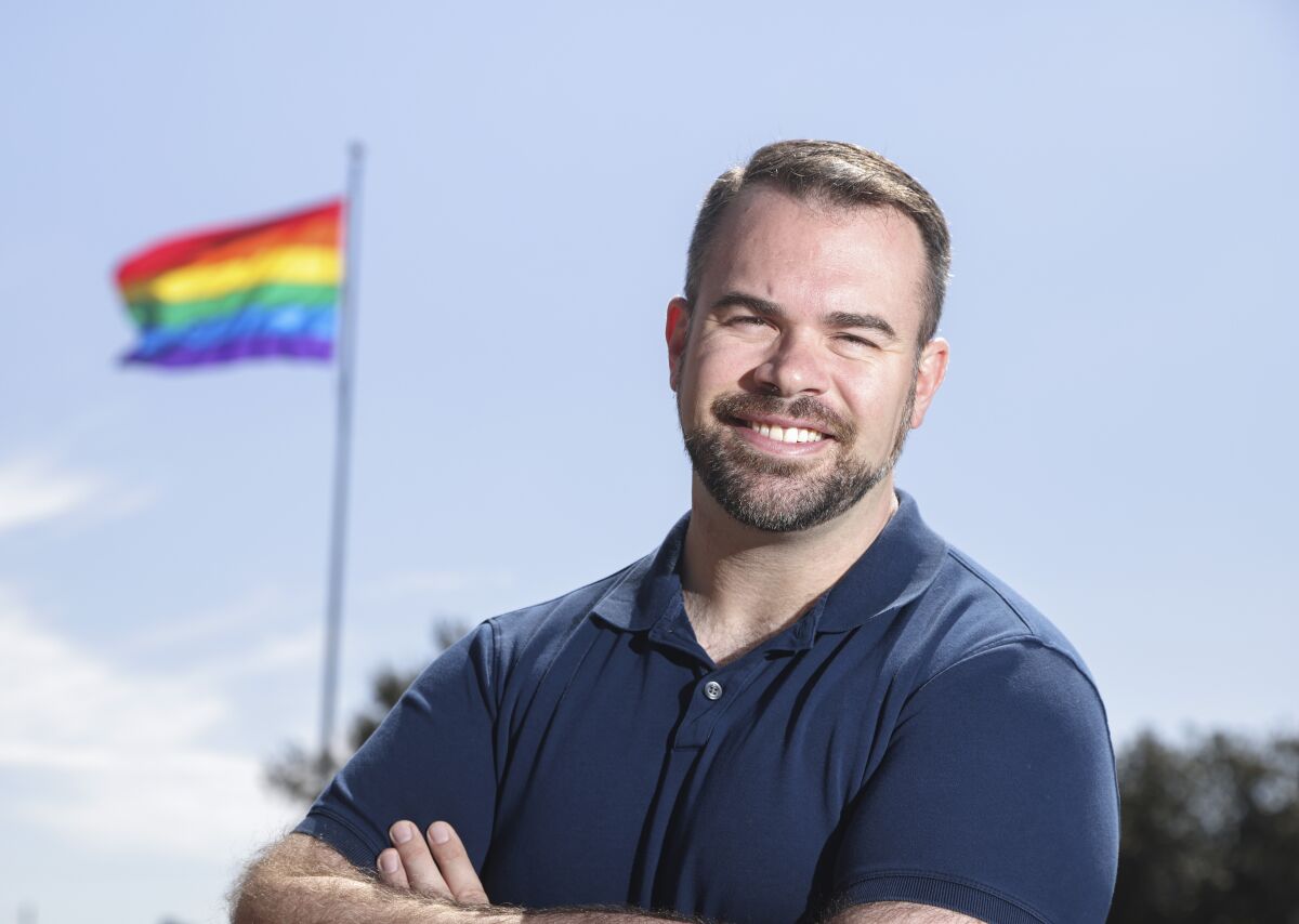 Casa Loto founder and president Craig Loto is shown in front of the Hillcrest Pride Flag. 