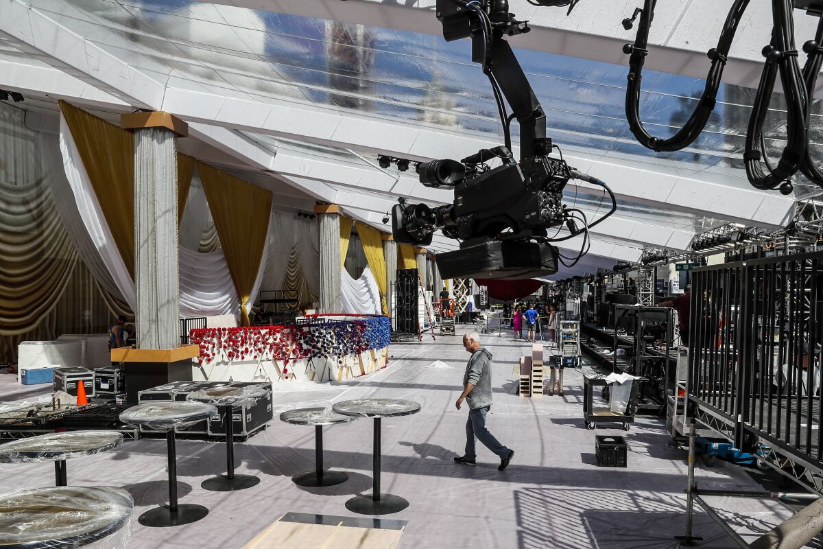 Construction continues on the red carpet on Hollywood Blvd. days before the 94th Oscars at Dolby Theater. 