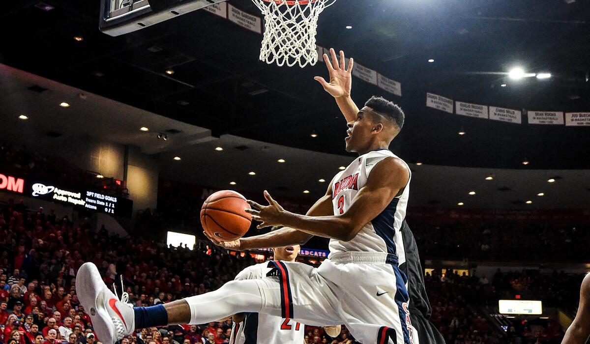 Arizona's Justin Smith shoots the ball during the first half of a game on Wednesday.