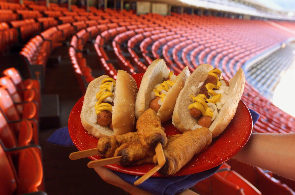Dodger Stadium is the backdrop for baseball inspired food. A plate full of Homemade Hot Dog Buns with hotdogs