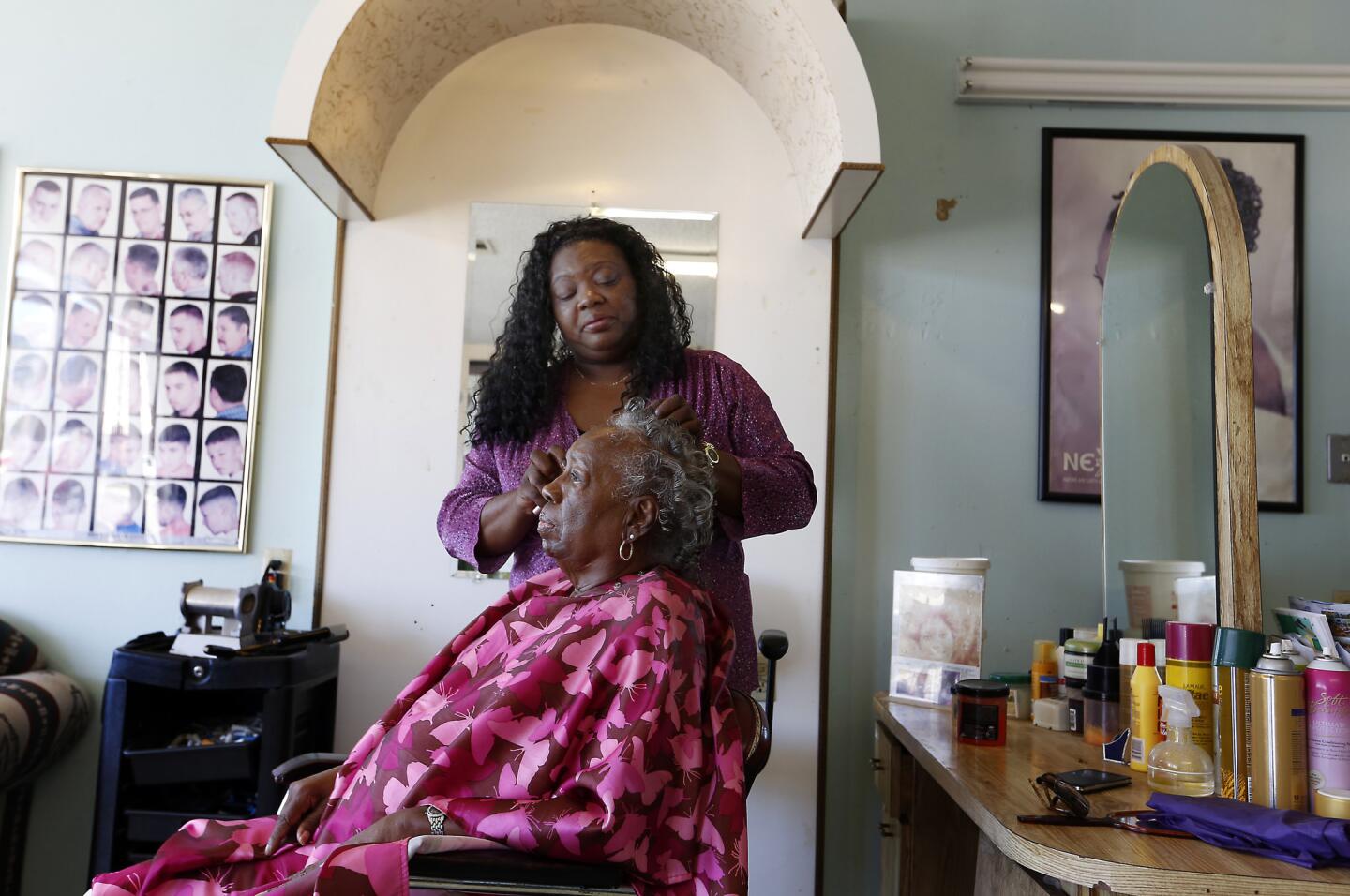 Vicki Lee, 58, works on Pandora Johnson's hair. Johnson, 84, started going to Lee's mother to have her hair done in 1958. After Lee's mother passed away, Lee continued to help her mother's former client.